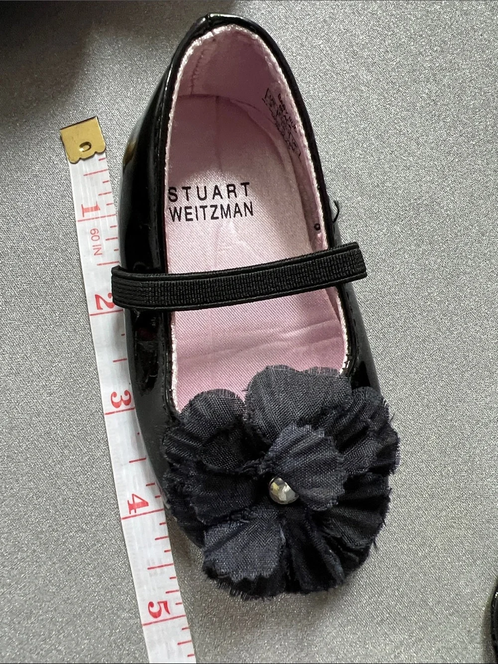 Stuart Weitzman Black Patent Mary Jane Shoes with Flower Accent